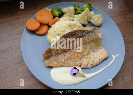 Fried Sea Bass Steak with Steamed Veggies Stock Photo