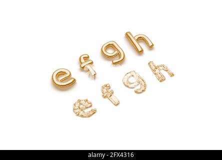 Inflated, deflated gold e f g h letters, balloon font, 3d rendering. Foil lowercase alphabet for birthday decoration. Matte helium or mylar typeset fo Stock Photo