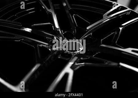 Black alloy wheels for premium cars, close-up. Purchase and replacement of autodisks. Stock Photo