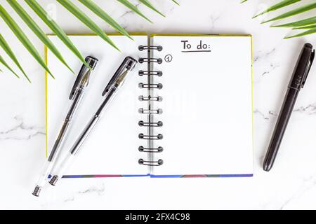 Top view of to do list in the planning notepad with the checklist and copy space on light background. Office management and education reminder concept Stock Photo