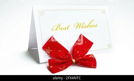 Best wishes text on greeting card with bow Stock Photo