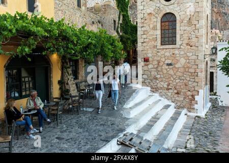 Monemvasia, Greece. 22nd May, 2021. Tourists sit in a café in the medieval walled town of Monemvasia, in the southeastern Peloponnese. Credit: Socrates Baltagiannis/dpa/Alamy Live News Stock Photo