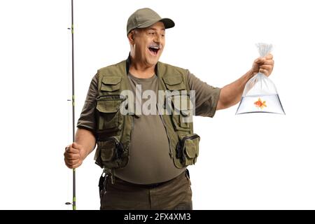 Happy fisherman holding a fishing pole and a golden fish in a plastic bag isolated on white background Stock Photo