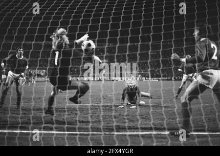 FC Antwerp against Ajax 2-1 UEFA Cup, Ruud Geels (lying down) scores 0-1, left goalkeeper Jean Trappeniers and right Van Riel (r), November 13, 1974, goalkeepers, sports, soccer, The Netherlands, 20th century press agency photo, news to remember, documentary, historic photography 1945-1990, visual stories, human history of the Twentieth Century, capturing moments in time Stock Photo
