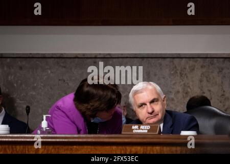 United States Senator Jack Reed (Democrat of Rhode Island), Chairman, US Senate Committee on Armed Services, right, confers with United States Senator Jeanne Shaheen (Democrat of New Hampshire), left, during a Senate Committee on Armed Services nominations hearing in the Dirksen Senate Office Building in Washington, DC, Tuesday, May 25, 2021. Credit: Rod Lamkey/CNP /MediaPunch Stock Photo