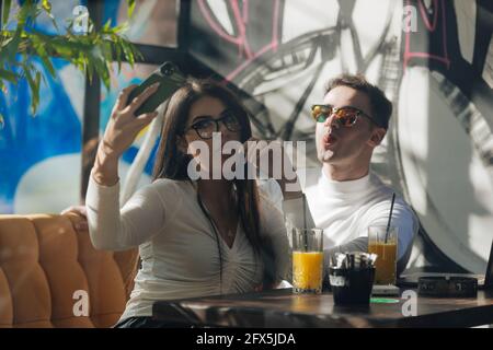 Co-workers spending time together on a break while working on a project on a lovely sunny day. Stock Photo