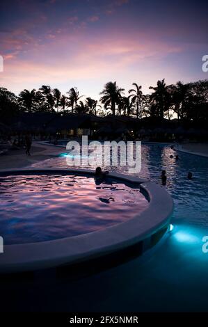 View of sunset from resort pool in Tamarindo, Costa Rica, Central America Stock Photo