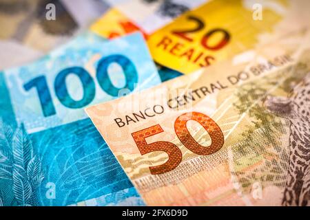 Brazil. 25th May, 2021. In this photo illustration one hundred, fifty and twenty reais, the real is the currency of Brazil. The Central Bank launched guidelines for the creation of a digital currency that will serve as an extension of the real in the country. (Photo by Rafael Henrique/SOPA Images/Sipa USA) Credit: Sipa USA/Alamy Live News Stock Photo