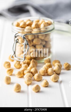Peeled roasted hazelnut kernels in jar. Stock Photo