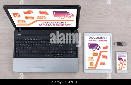 Document management concept shown on different information technology devices Stock Photo