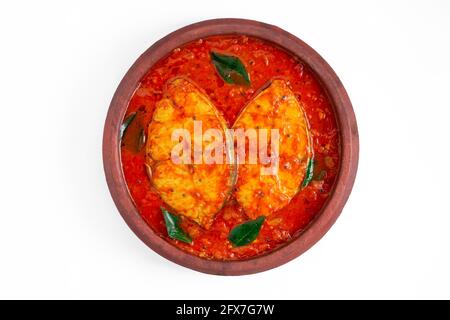 Fish curry, traditional Indian fish curry ,kerala special ,arranged in a white bowl garnished with curry leaves with white background Stock Photo
