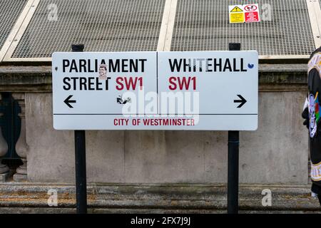 London. UK- 05.23.2021. The sign for Parliament Street and Whitehall, the location of many UK government offices in the City of Westminster. Stock Photo