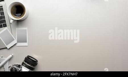 Mock up scene creative flat lay in travel concept with travel items, camera, photo frame, laptop, coffee cup and copy space on white background Stock Photo
