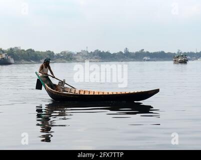 Boat taxis crossing the Buriganga river in Dhaka, Bangladesh.