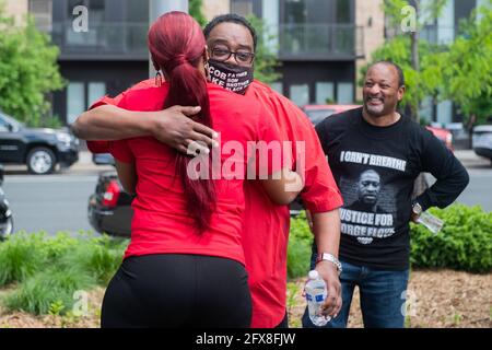 Jacob Blake Sr, the father of Jacob Blake Jr hugs Bridgette Floyd, George Floyd's sister at Commons Park during the remembrance event on the 1 Year Anniversary of his death on May 25, 2021 in Minneapolis, Minnesota. Photo: Chris Tuite/ImageSPACE /MediaPunch Stock Photo