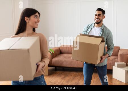 Happy man and woman holding cardboard boxes Stock Photo
