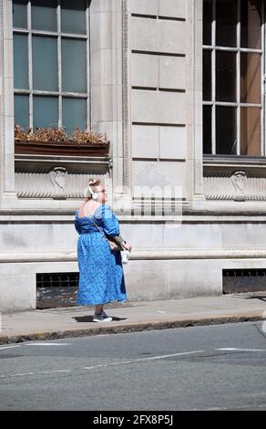 Woman in Liverpool walking past the Martins Bank building on Water Street Stock Photo