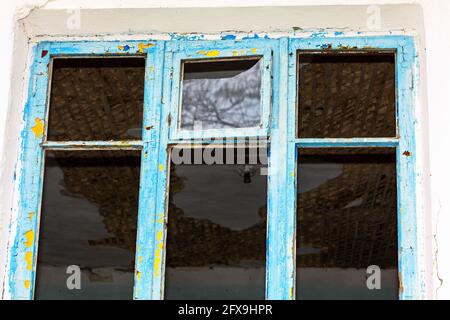 Old window without glass , abandoned house with ghosts Stock Photo