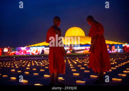 Patum Thani, Patum Thani, Thailand. 26th May, 2021. Thailand's Wat Dhammakaya temple organized a massive candle display on their temple grounds to commemorate the Buddhist holiday Visakha Bucha. It celebrates the birth, enlightenment, and death, the three most important events in the life of the Buddha Siddhartha Gautama. Over 180,000 candles were lit to show scenes from these three events, making a massive display visible from the air. Credit: Adryel Talamantes/ZUMA Wire/Alamy Live News Stock Photo