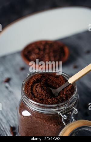 closeup of a hermetic glass jar full of ground coffee on a gray rustic wooden table Stock Photo