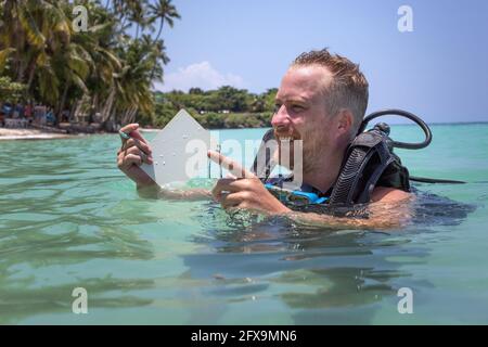 Panglao, Philippines - April 29, 2021: Scuba diver in confined water teaching, studying, evaluating skills Stock Photo