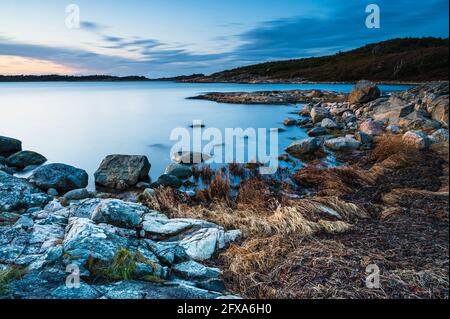 Coastal scenery in evening light Stock Photo