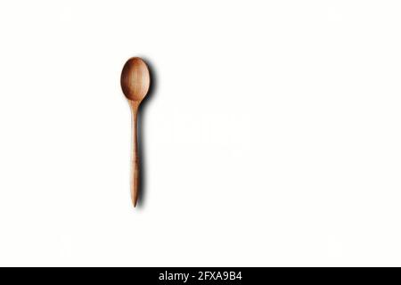 Directly Above View Of Wooden Spoon Against White Background Stock Photo