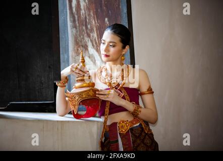 Beautyful Thai woman wearing thai traditional clothing, Beautiful woman, Thai national costume, traditional Thai dress, Thai woman, good mood Stock Photo