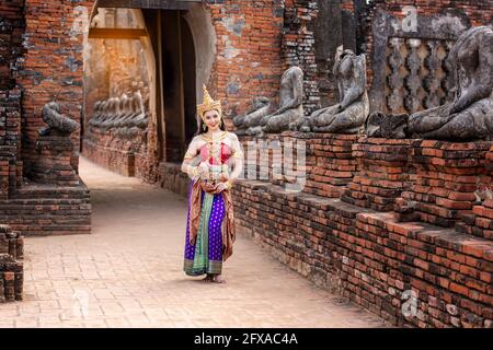 Beautyful Thai woman wearing thai traditional clothing, Beautiful woman, Thai national costume, traditional Thai dress, Thai woman, good mood Stock Photo