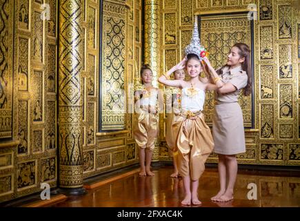 Thai traditional dress. Young kid Actors performs Thai ancient dancing Art of Thai classical dance in Thailand Stock Photo