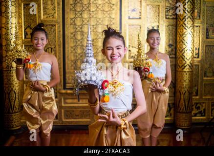 Thai traditional dress. Young kid Actors performs Thai ancient dancing Art of Thai classical dance in Thailand Stock Photo