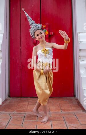 Thai traditional dress. Young kid Actors performs Thai ancient dancing Art of Thai classical dance in Thailand Stock Photo