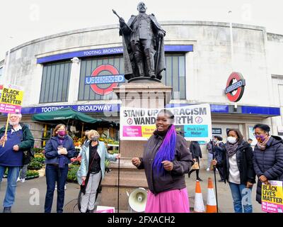 London, UK. 25/05/21. Anti-racism campaigners including local councillors mark George Floyd's death one year on with speeches and taking the knee. Stock Photo