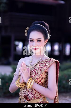 Beautyful Thai woman wearing thai traditional clothing, Beautiful woman, Thai national costume, traditional Thai dress, Thai woman, good mood Stock Photo