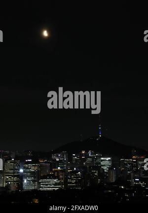 Seoul, South Korea. 26th May, 2021. A moon is seen in the cloud in Seoul, South Korea, May 26, 2021. Credit: Wang Jingqiang/Xinhua/Alamy Live News Stock Photo