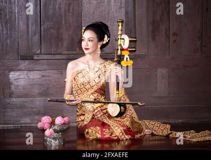 Beautyful Thai woman wearing thai traditional clothing, Beautiful woman, Thai national costume, traditional Thai dress, Thai woman, good mood Stock Photo