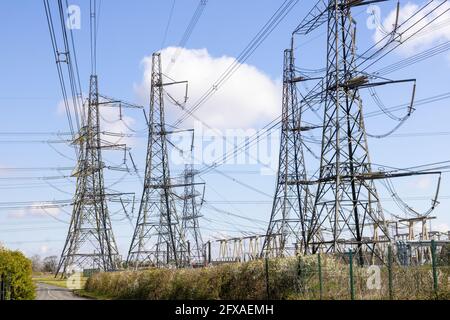 Pylons carrying electricity from the coal fired power stations at Ferrybridge, West Yorkshire, England UK Stock Photo