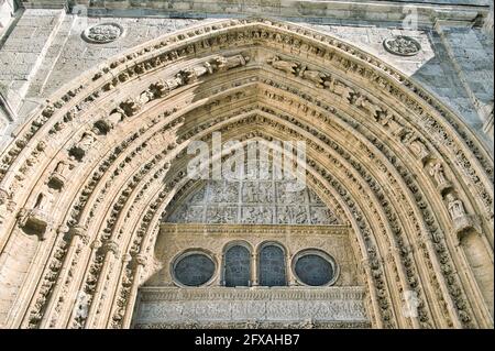 Details of the carved pointed arch entrance of Palencia Cathedral in