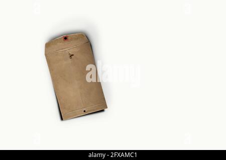 Isolated shot of closed an old envelope on white background Stock Photo