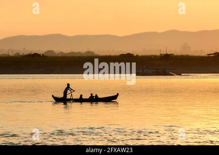 Sunrise on the Irrawaddy River (Ayeyarwaddy River) in Myanmar (Burma).  It is the country's largest river and most important commercial waterway. Orig Stock Photo