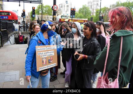 London, UK, 26 May 2021 Sodem protestor speaks to passing students. Protestors outside Dominic Cummings committee appearance in Whitehall. Credit: JOHNNY ARMSTEAD/Alamy Live News Stock Photo