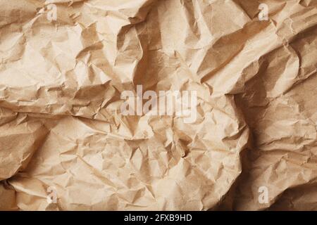 Craft crumpled paper as a texture background. full screen Stock Photo