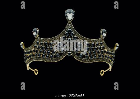 tiara with black stones and diamonds isolated on black Stock Photo