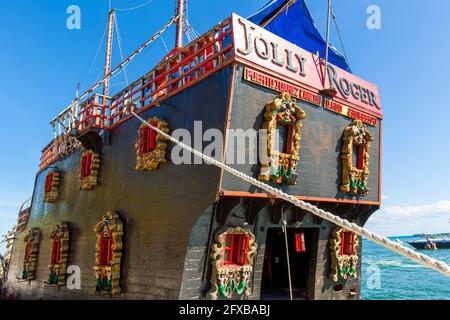 Cancun, Mexico - 20 December, 2020: Jolly Roger Pirate Show and cruise entertaining public with a spectacular battle between pirates in the Caribbean sea of the Riviera Maya Stock Photo