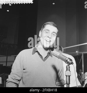 Isan Philippe ( oui oui oui ) sings in the radio program Week out Week,  Jean Philippe during rehearsal in d background Dolf van de Linden, March  18, 1960, RADIOPROGRAMMAS, backgrounds, rehearsals,