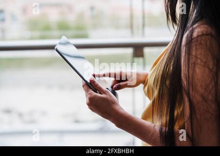 Female professional working on digital tablet at office Stock Photo