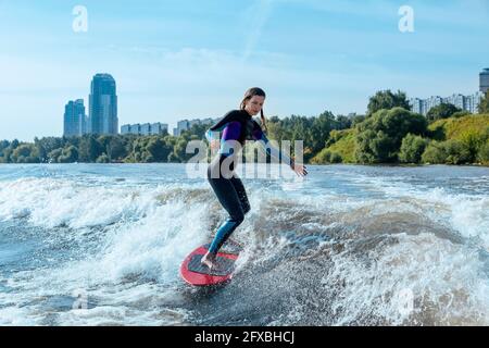 Woman wakesurfing in Moskva river Stock Photo