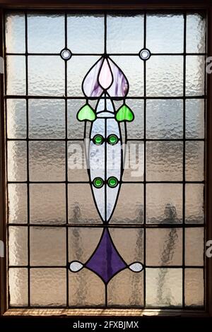 Art nouveau window with tulip design at the Rhu Inn, Scotland Stock Photo