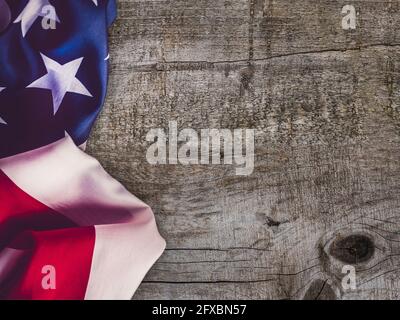 American Flag lying on an empty table. Place for your inscription. Beautiful card. Closeup, view from above. National holiday concept. Congratulations Stock Photo