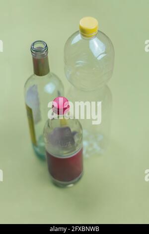 Studio shot of three empty glass and plastic bottles Stock Photo